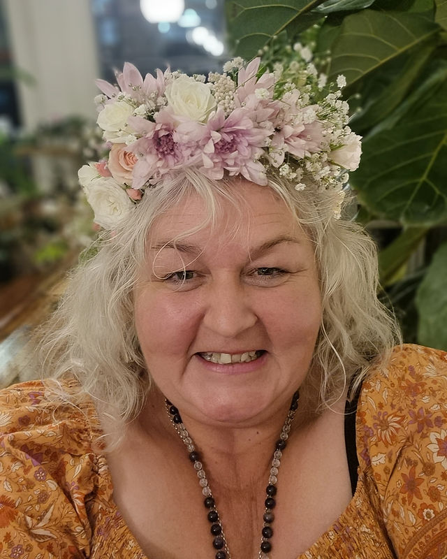Tracey Crandall wearing a gorgeous flower crown. Founder of TraceyLidene Art and CharlieRae Wellbeing